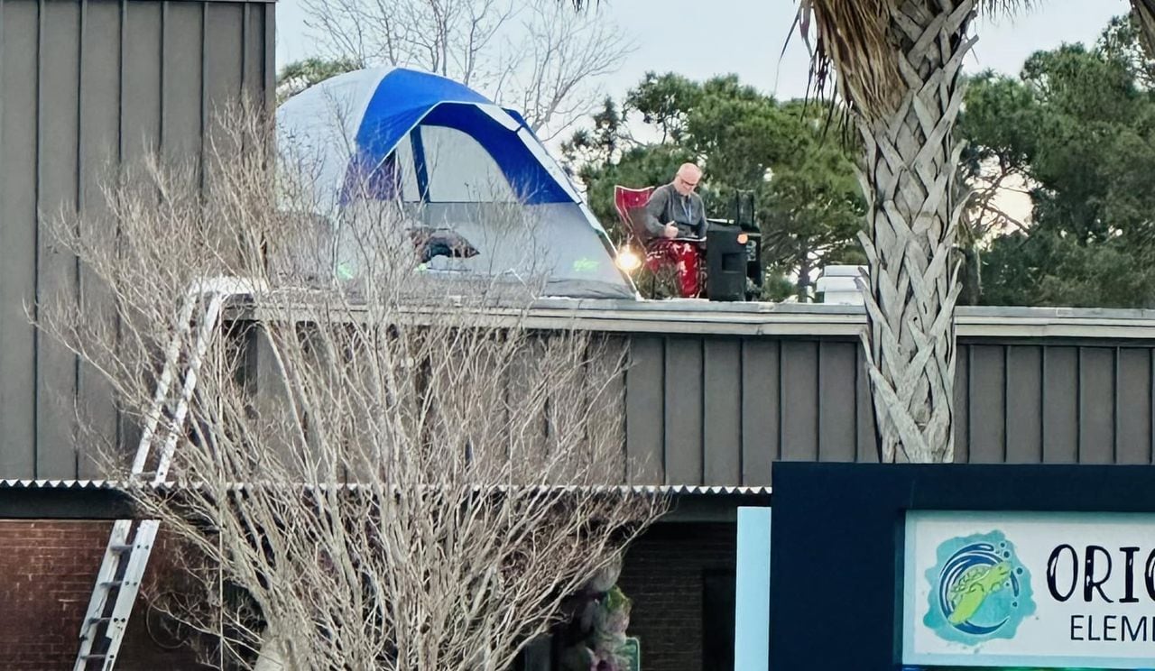 Florida principal spends night on school roof in Crimson Tide pajamas to motivate students