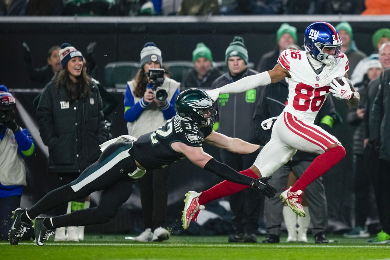 Baltimore Ravens cornerback Marlon Humphrey tackles San Francisco 49ers quarterback Brock Purdy