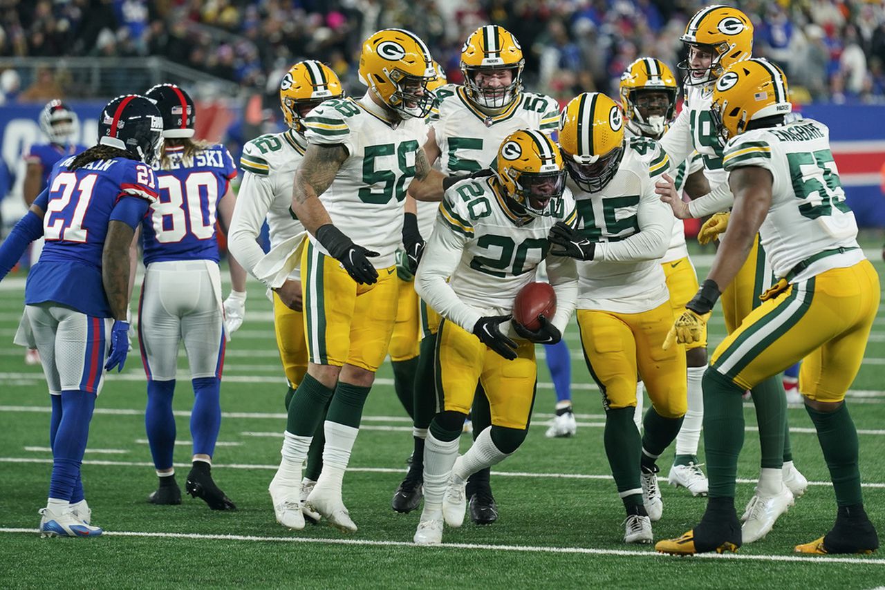 Green Bay Packers safety Rudy Ford celebrates after recovering a muffed punt