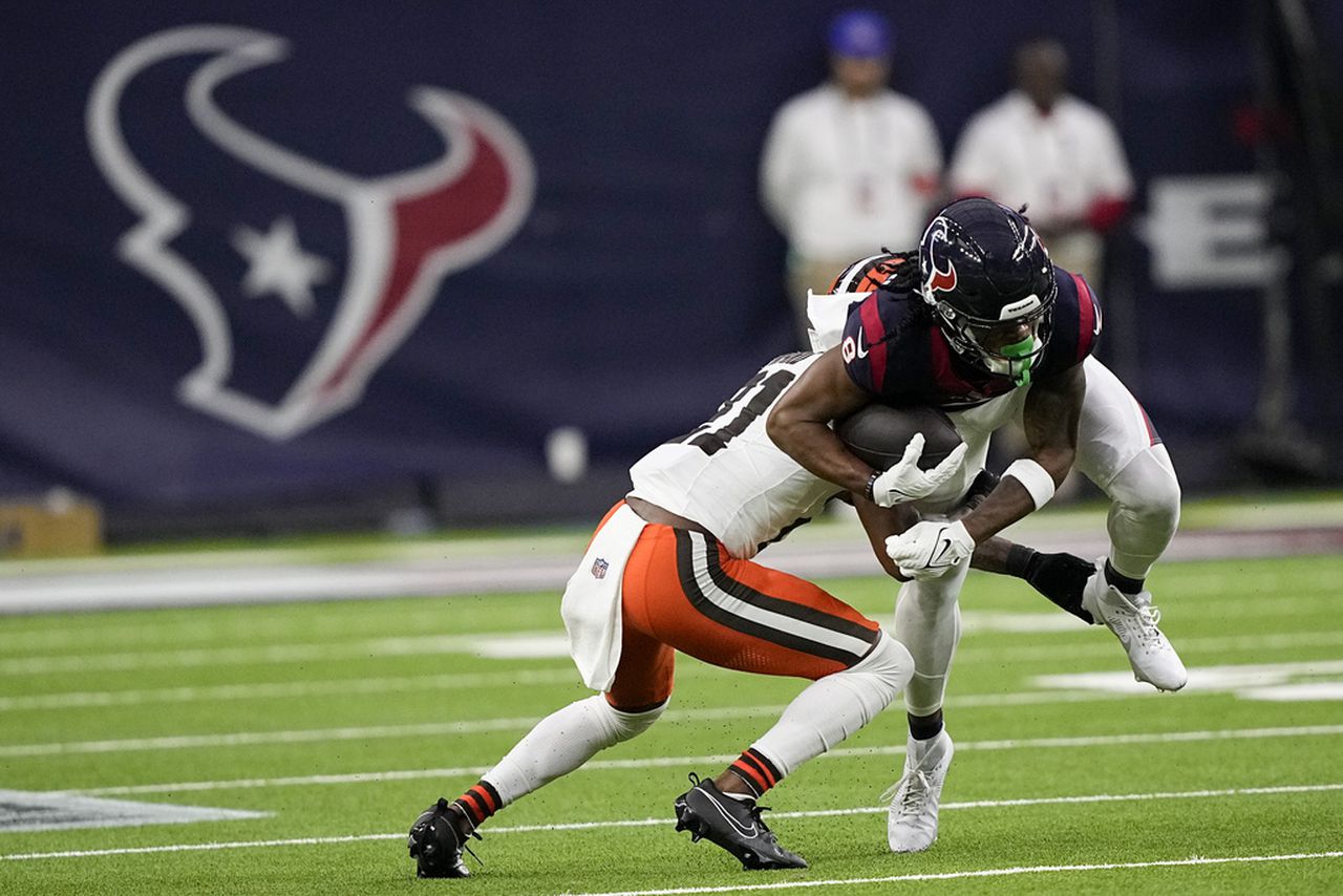 Houston Texans wide receiver John Metchie III holds on to the football for a reception