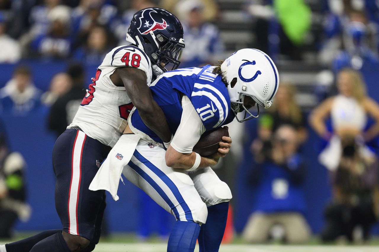 Houston Texans linebacker Christian Harris sacks Indianapolis Colts quarterback Gardner Minshew