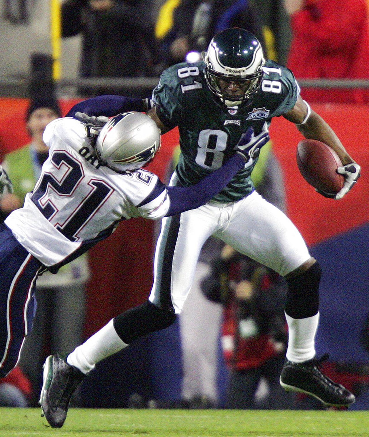 Philadelphia Eagles wide receiver Terrell Owens runs with the football after a reception against the New England Patriots during Super Bowl XXXIX