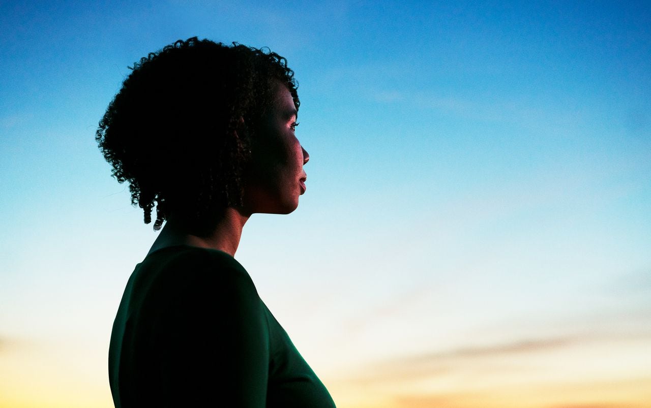 Woman looking ahead at dusk